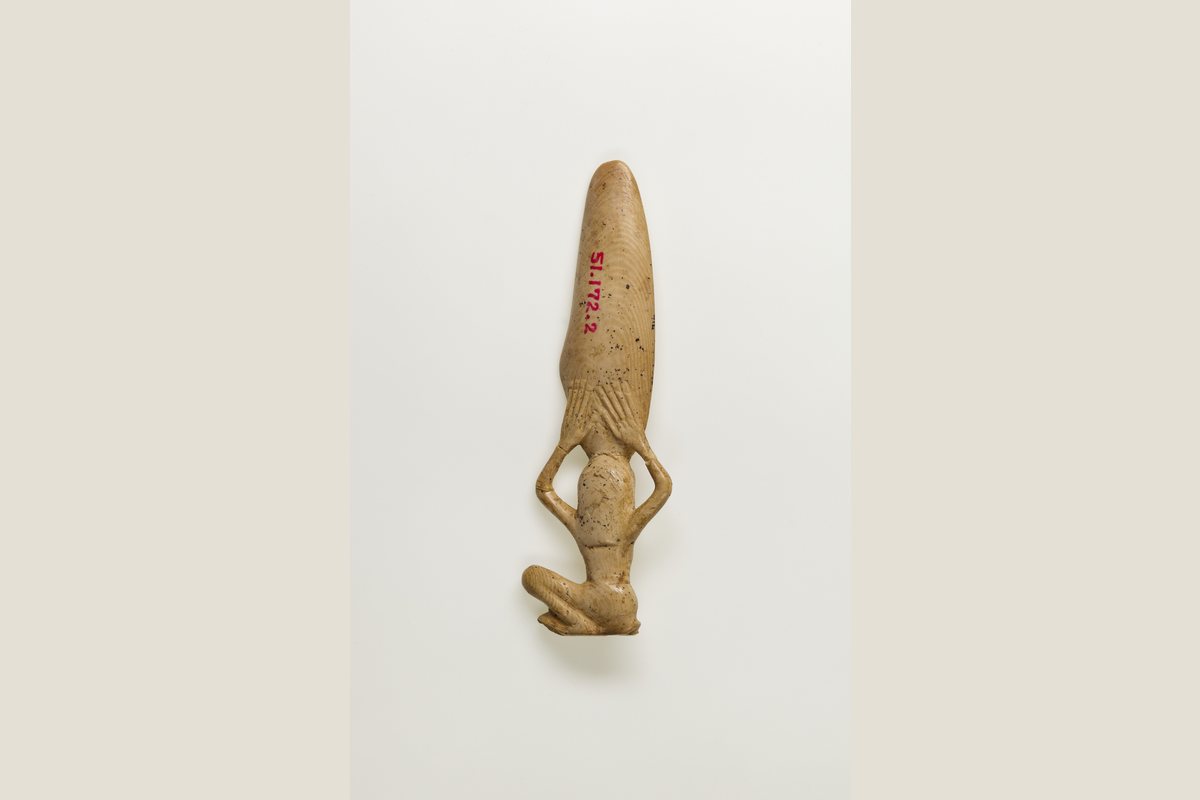 Ancient Egyptian cosmetic spoon in the form of a swimming woman